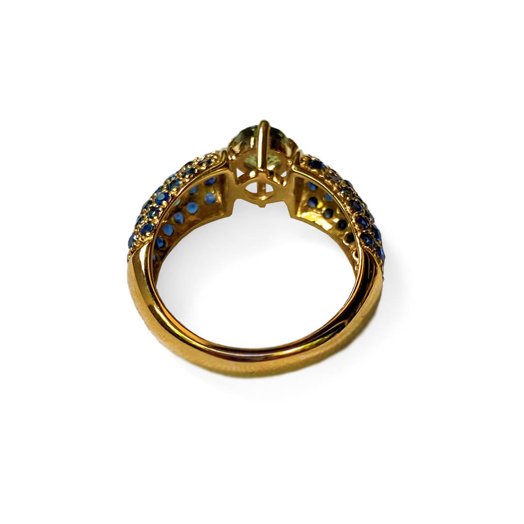 Blue and Green Sapphire Ring photographed on a white background