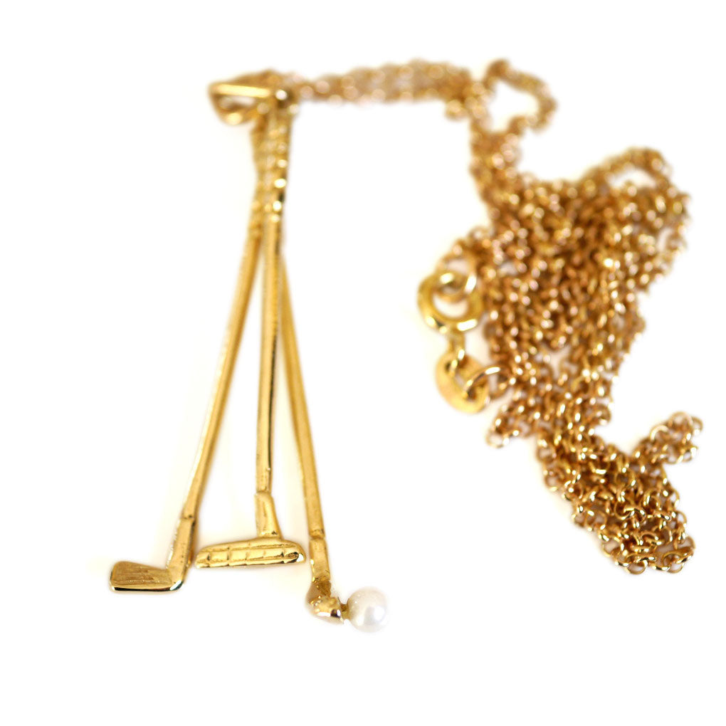 1973 Gold & Pearl Golf Clubs Necklace photographed on a white background
