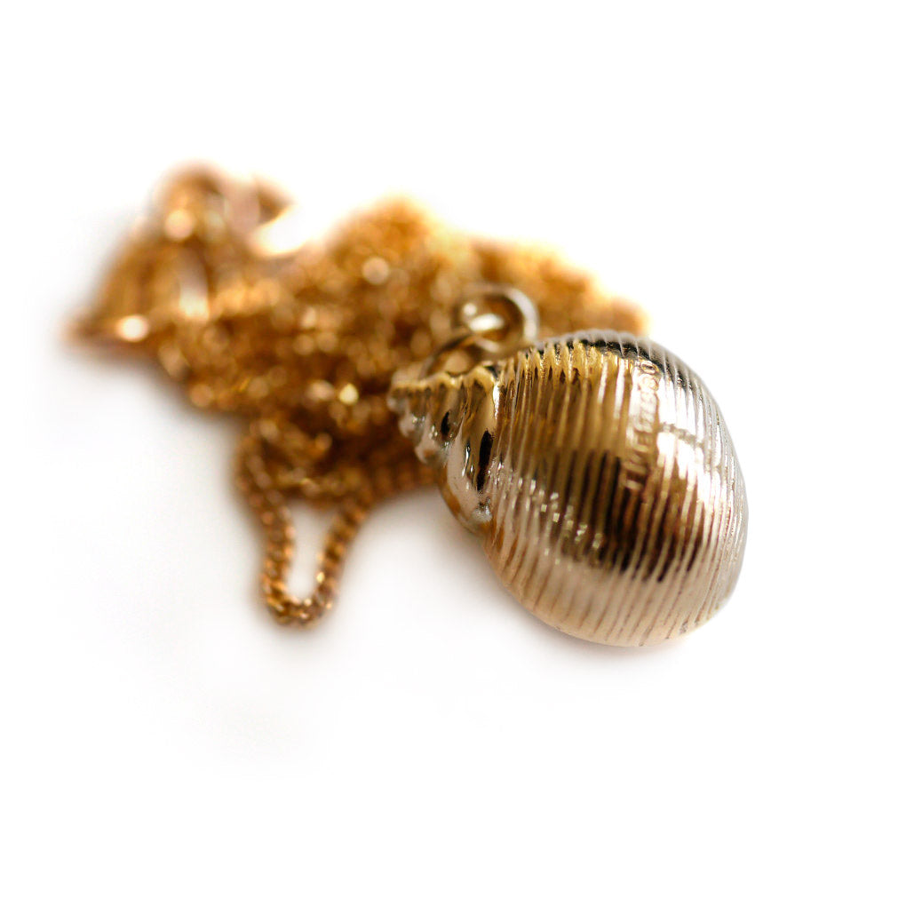 Gold Glorious Gold: 1968 Conch Shell Pendant
