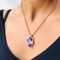Alluring Amethyst Cocktail Necklace photographed on a model wearing a black top