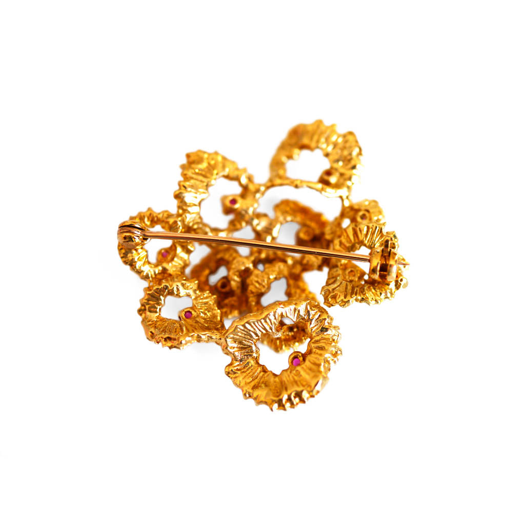 Seventies Barked Ruby Flower Brooch photographed on a white background
