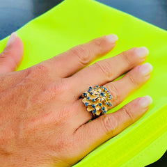 Vintage 1970s Bombé Sapphire Cocktail Ring, nicknamed "Le Cactus de Baroque Rocks" worn on models ring finger and photographed on a lime green background